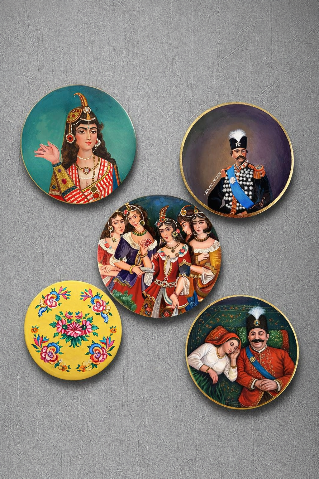 Set of five decorative plates with artistic illustrations on a gray background