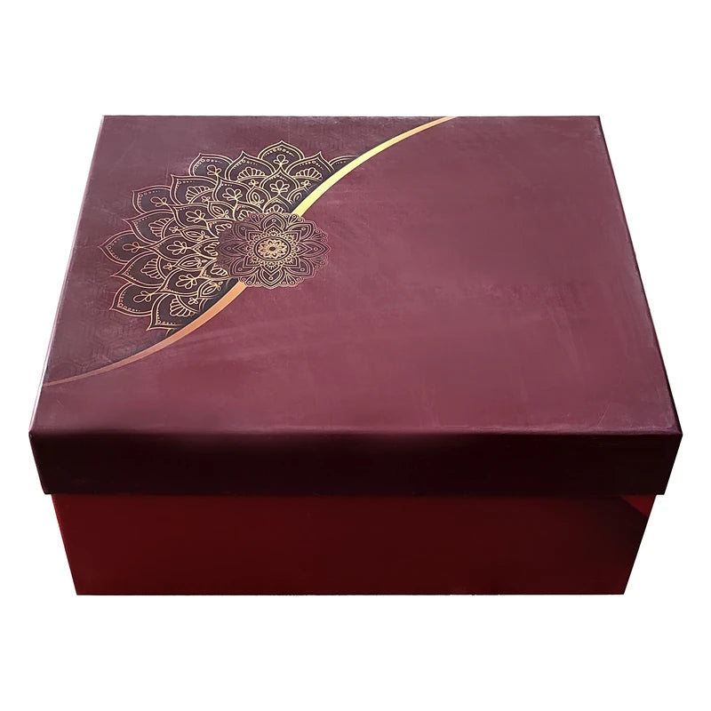 Maroon gift box with gold mandala design on a white background