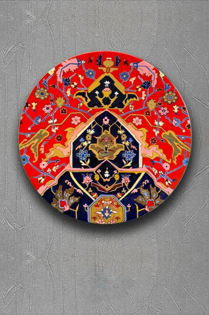 Decorative round plate with intricate patterns on a gray background