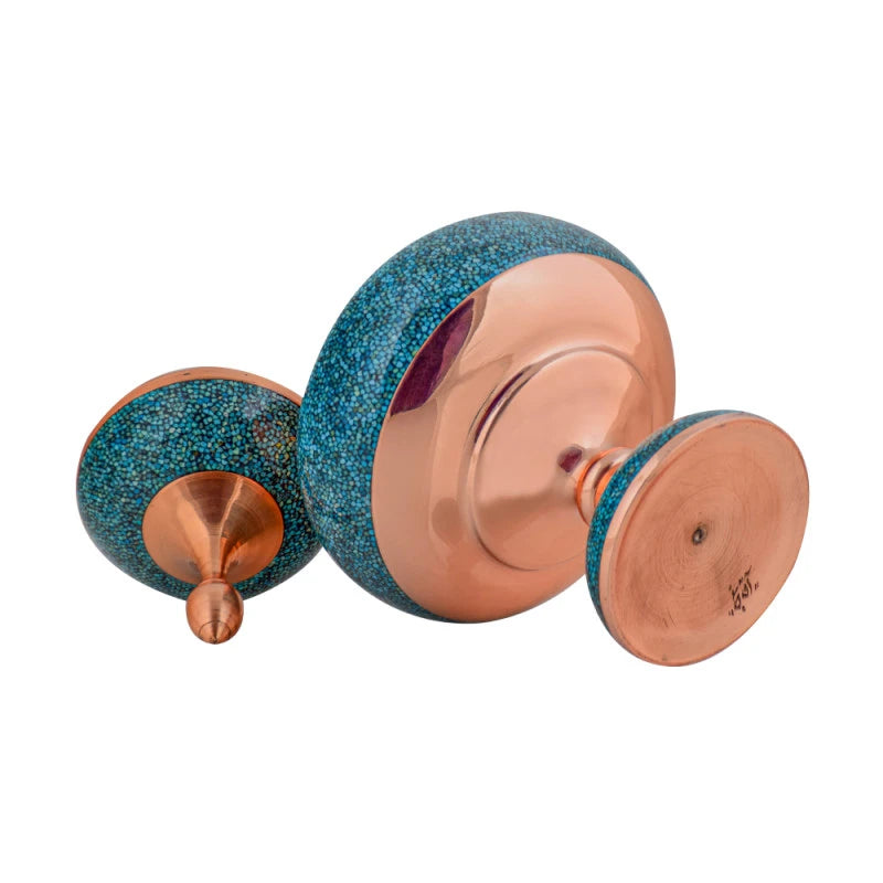 Pair of blue and copper dumbbells on a white background