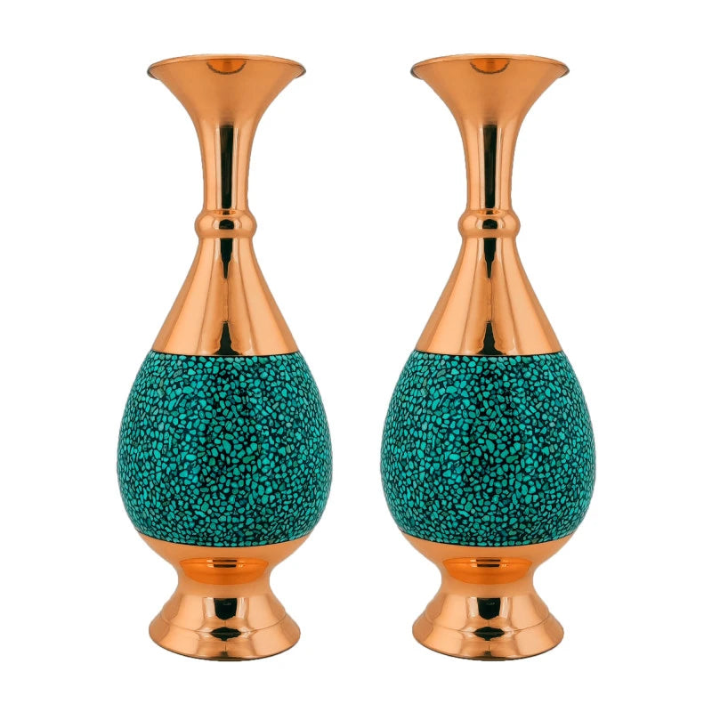 Two decorative vases with copper top and turquoise base on a white background