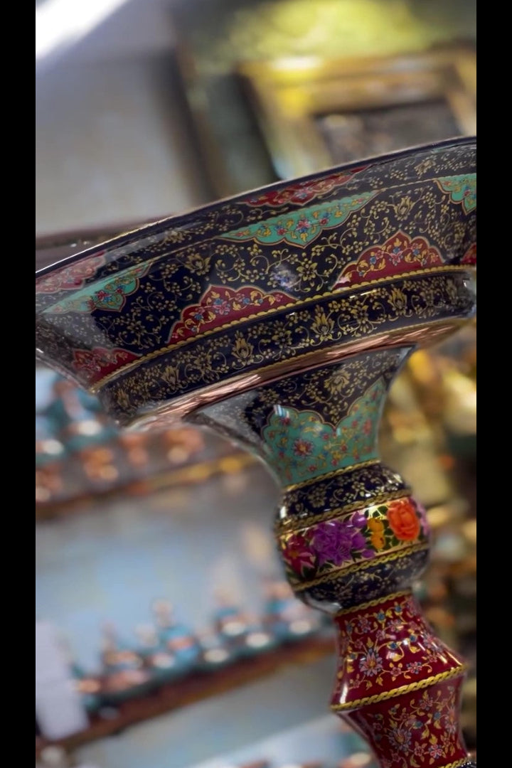 Decorative object with intricate patterns and colors, possibly a piece of jewelry or a decorative item.