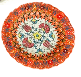 Decorative plate with colorful floral design on a white background