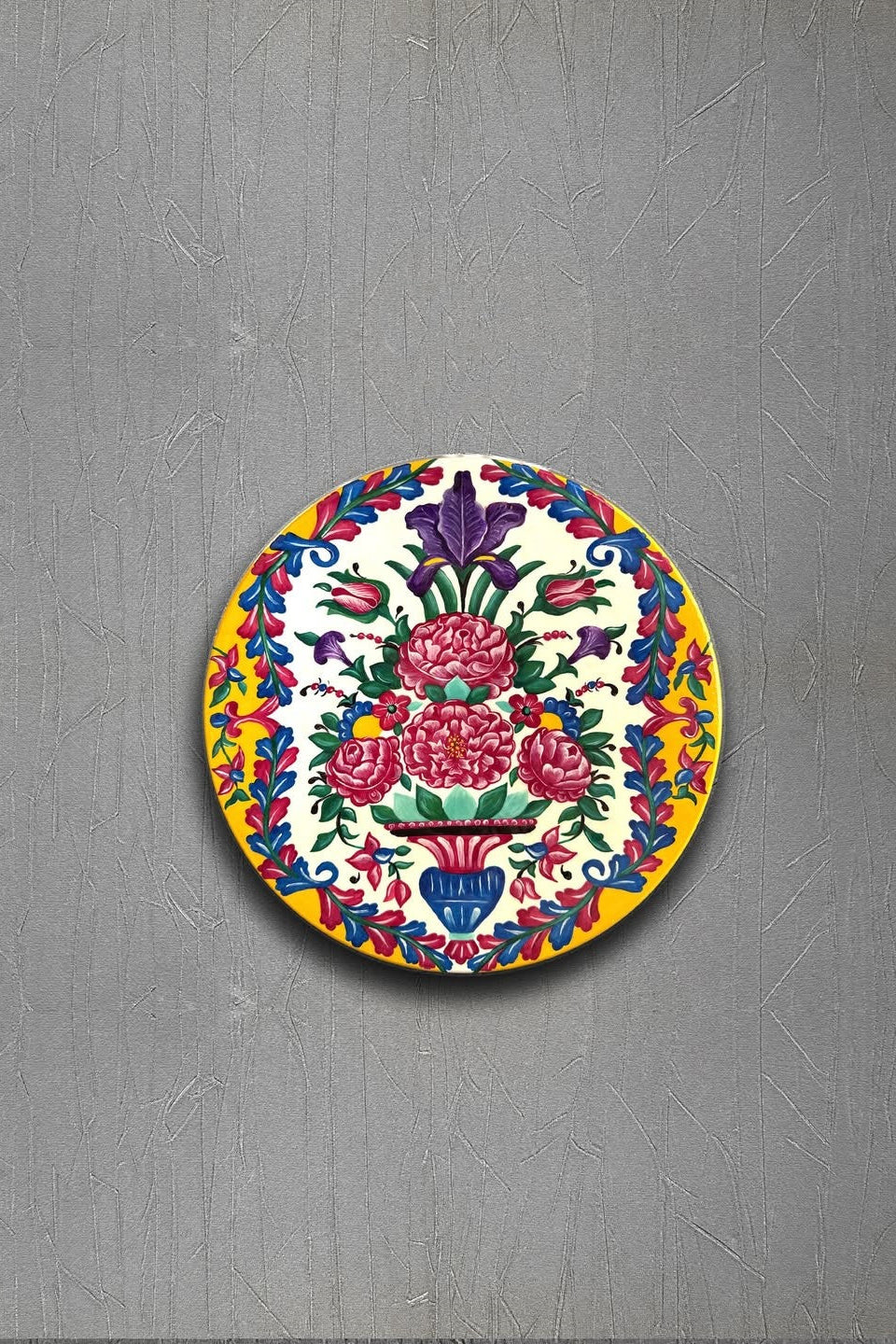 Decorative plate with floral design on a gray background
