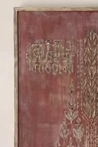 Decorative wall panel with intricate patterns on a red background