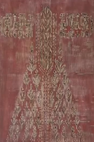 Decorative fabric with intricate patterns on a red background